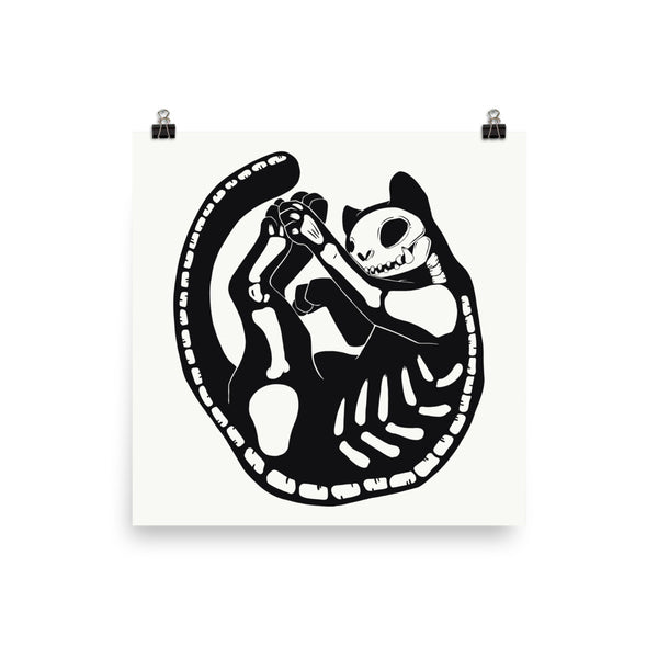 Black cat skeleton illustration in a playful pose, displayed as a matte art print on archival paper.