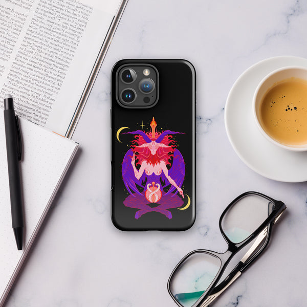 Baphomet tough case for iPhone® displayed on a marble surface with coffee and glasses, showcasing original illustration.