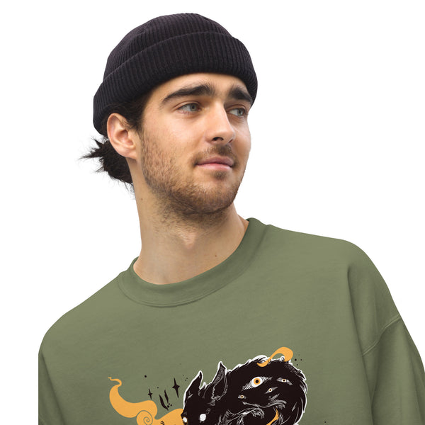 Person wearing a green sweatshirt with a gothic anime-style wolves illustration and multi-eye design, accessorized with a black beanie.