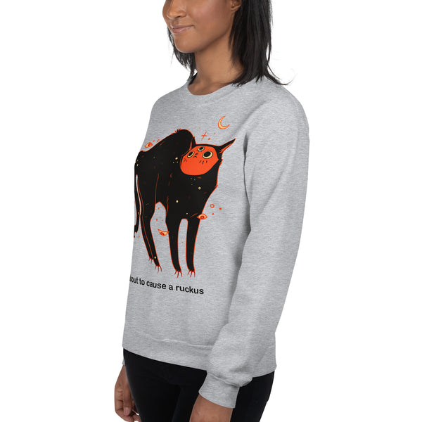 Unisex sweatshirt featuring Orion the black cat, saying "I'm about to cause a ruckus" in a fun design.