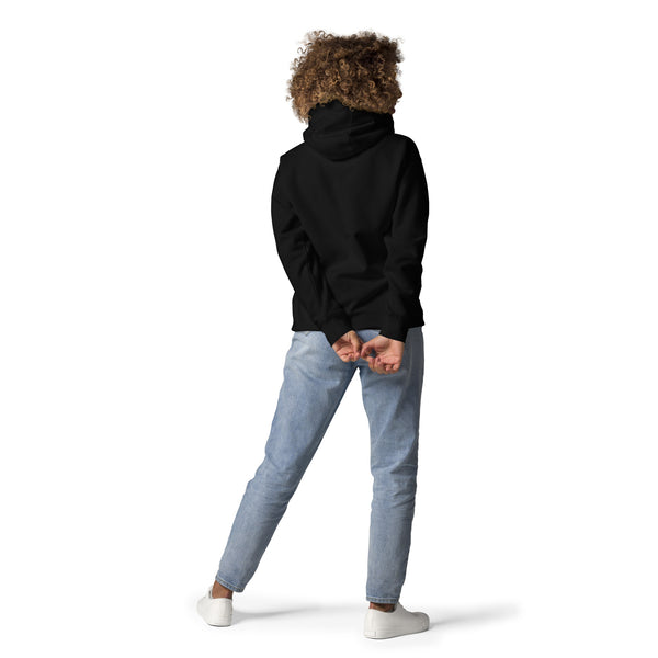 Person wearing black unisex hoodie with moth illustration, featuring front pouch pocket and matching drawstrings, standing casually.