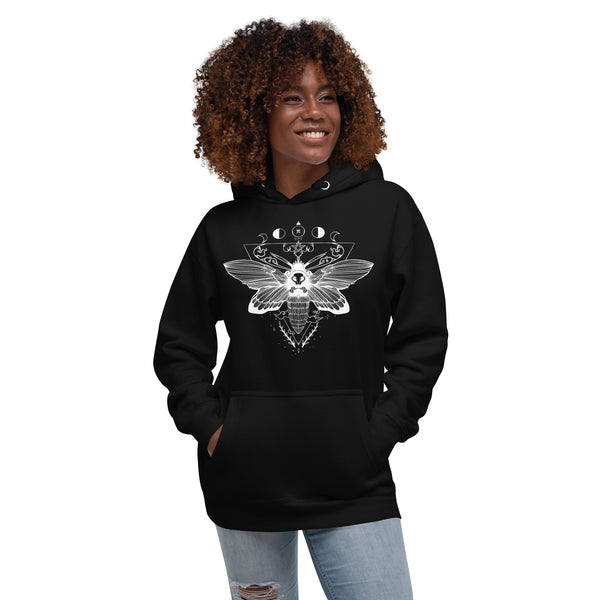 Unisex hoodie with witchy moth illustration, featuring a front pouch pocket and matching drawstrings, worn by a smiling person.