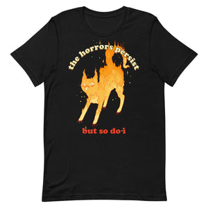 Unisex goth alt witchy black t-shirt with fire cat illustration and quote "The horrors persist but so do I" in yellow and red text