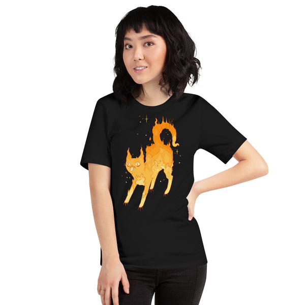 Person wearing black unisex t-shirt with fire cat illustration, perfect for goth, alt, witchy, and gothic styles.