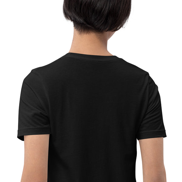 Back view of a person wearing a black unisex Fire Cat graphic T-shirt, made from eco-friendly, 100% combed and ring-spun cotton fabric.