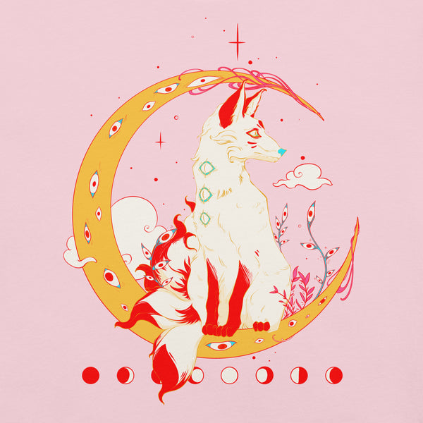 Kitsune fox graphic design on pink t-shirt, featuring original artwork and a moon motif with vibrant colors.