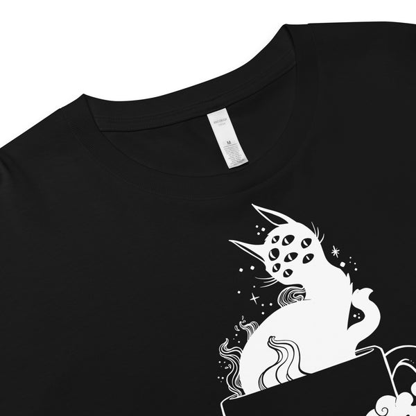 Gothic crop top featuring a hand-drawn black cat with multiple eyes inside a coffee cup, perfect for a witchy aesthetic.